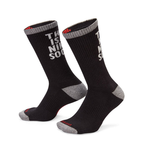 Black cushioned crew socks with gray toe/heel and 'THIS IS A NIKE SOCK' on the shaft
