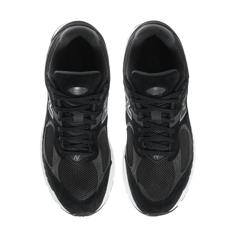 Men's black lace-up sneakers with mesh upper, padded collar, and round toe