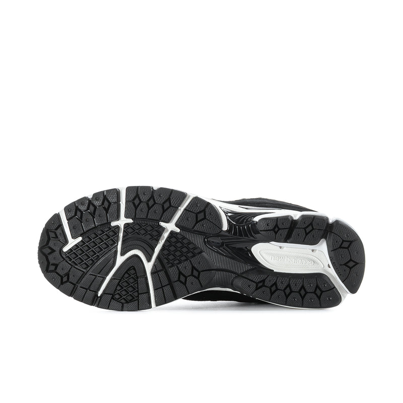 Men's black outsole with white traction areas and textured rubber tread