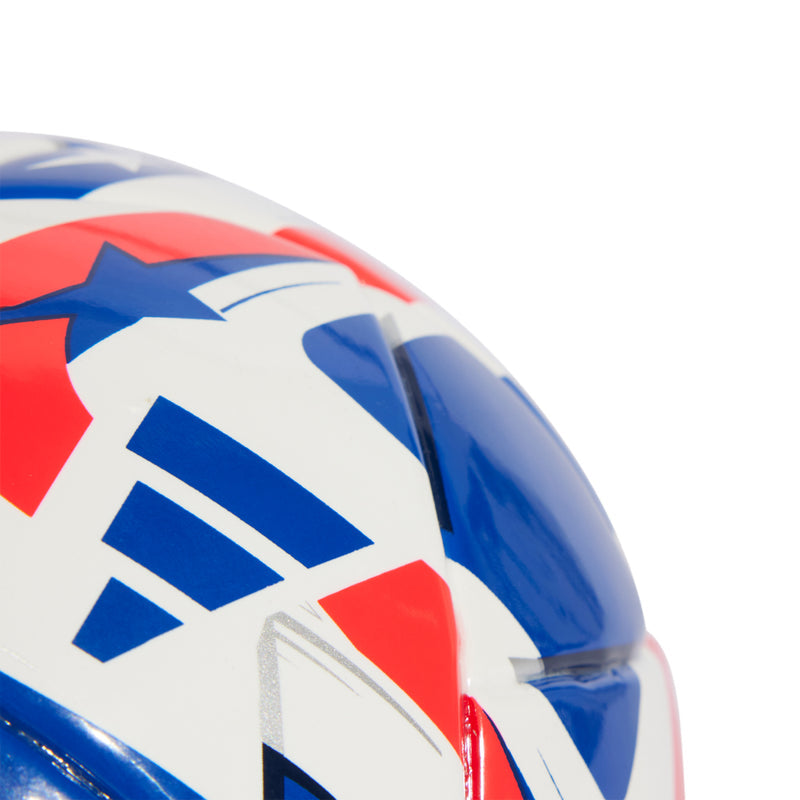 Mini soccer ball close-up of blue, white, and red stripe design