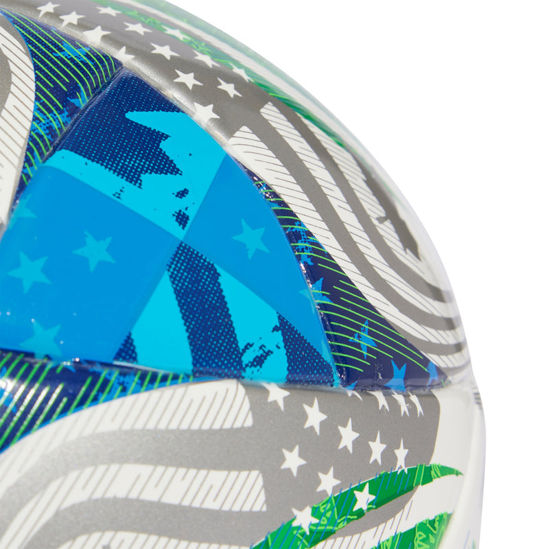 White mini ball with blue starburst panel, gray stripes, and green accents