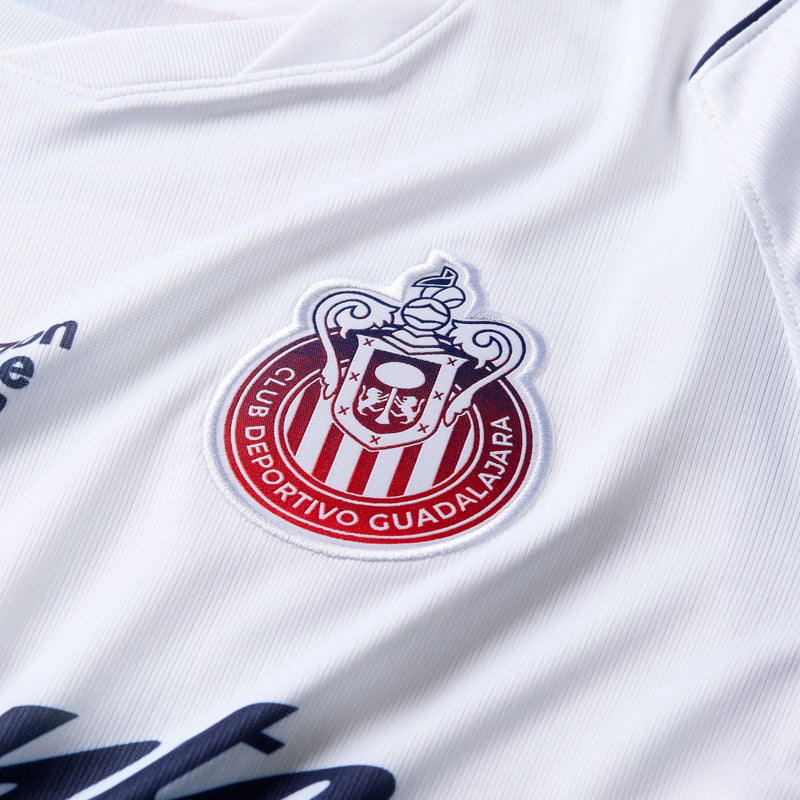 Men's white soccer jersey close-up of Chivas crest logo