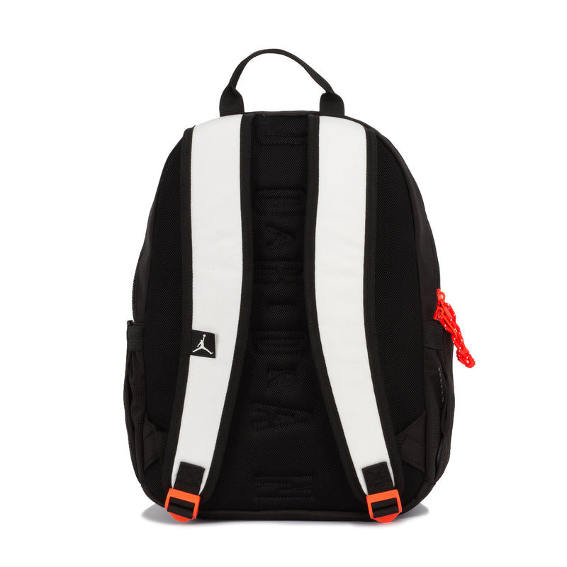Air Jordan lunch backpack (18L) back view with padded straps, white/black panels, red pull