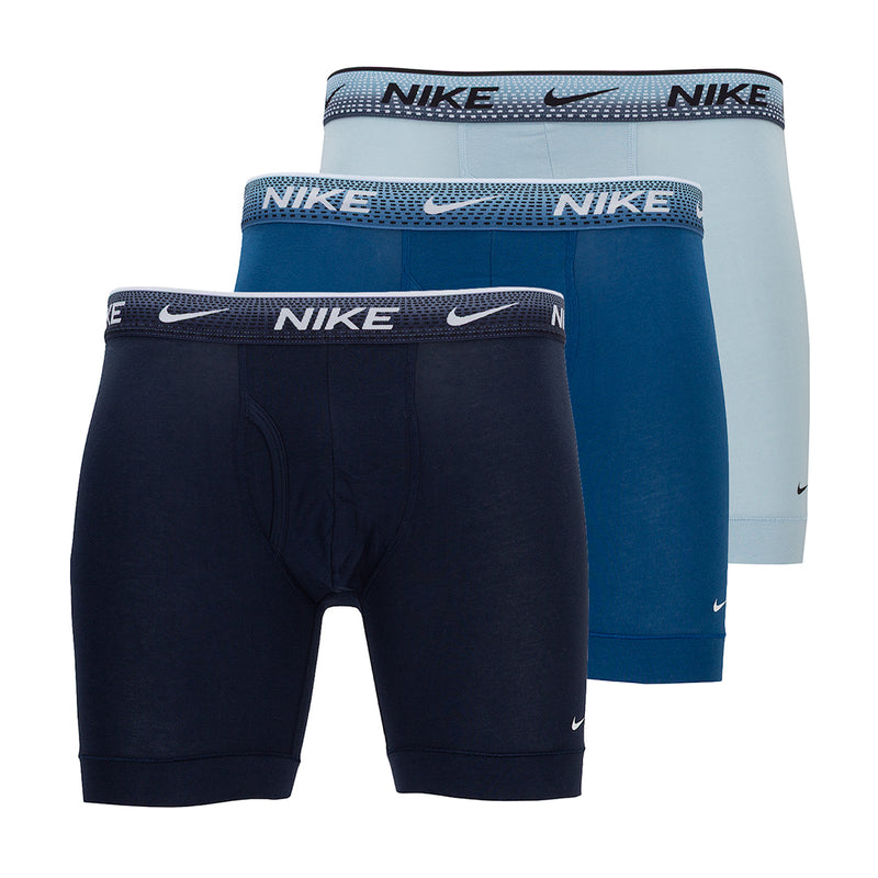 Stack of boxer briefs in navy, teal, and light blue with NIKE logo waistband