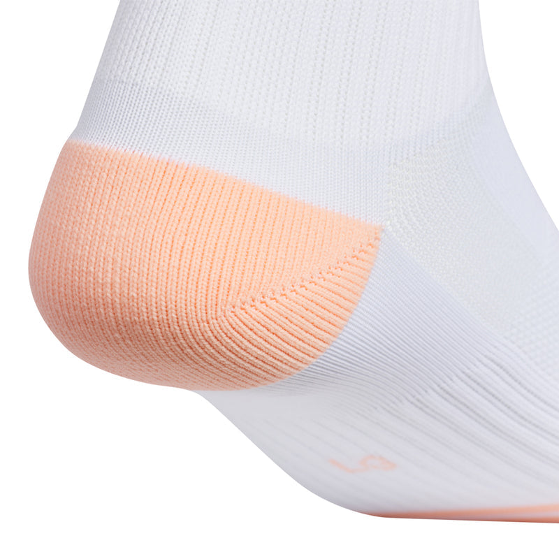 White high quarter athletic sock with orange heel panel and knit pattern
