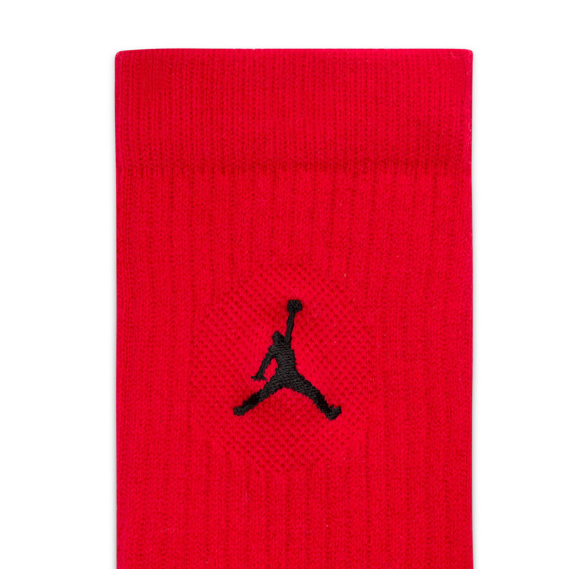 Red unisex crew sock with black Jordan logo on ribbed knit