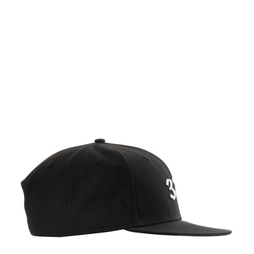 Black baseball cap side view with small white '3' logo and flat brim
