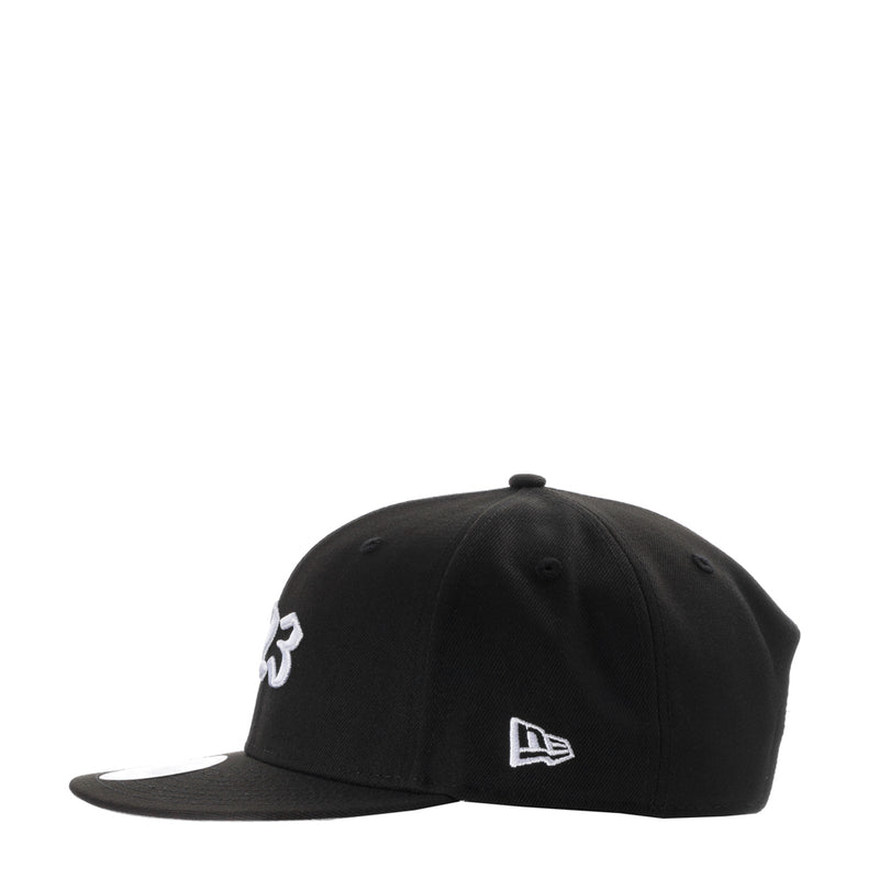 Black baseball cap with white '3' side logo and New Era flag, flat brim