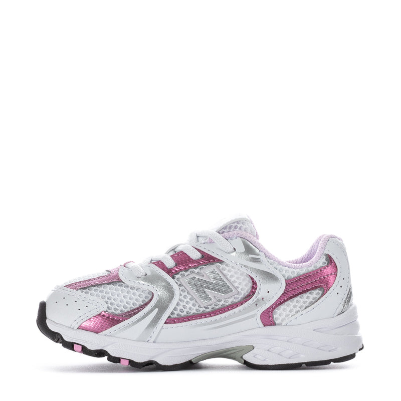 Toddler sneakers, side view in white with pink panels and padded collar
