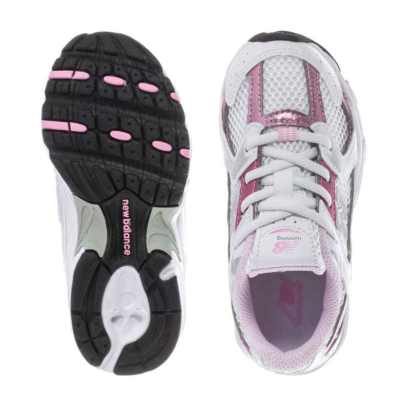 Toddler sneakers outsole and inner view, black tread and white-pink upper