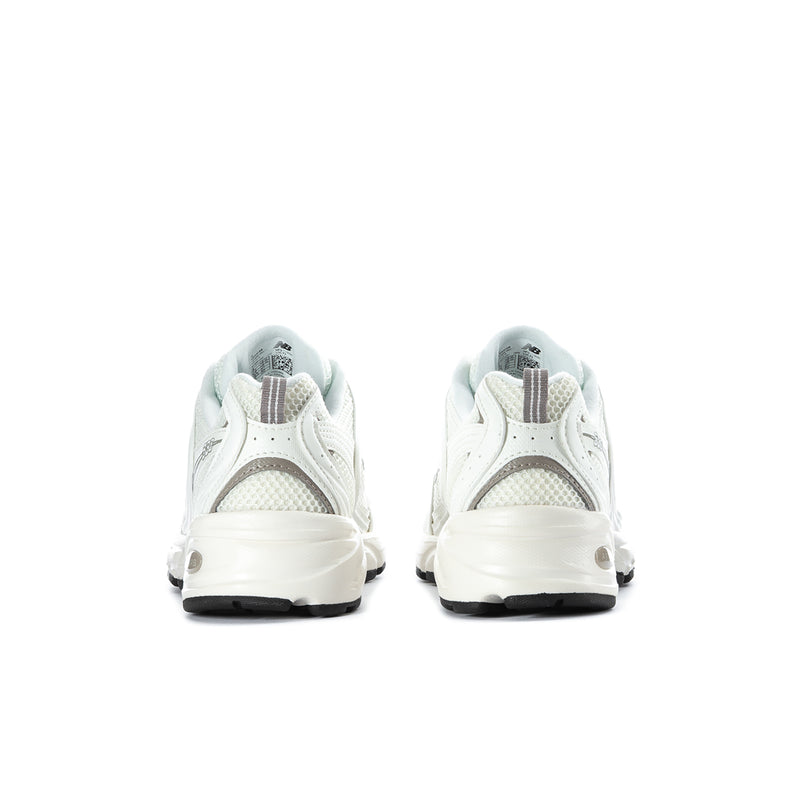 Off-white New Balance 530 wide women's sneakers from the back with cushioned heel