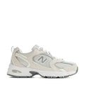 Wide women’s sneakers in light beige with grey mesh panels, white laces, N logo