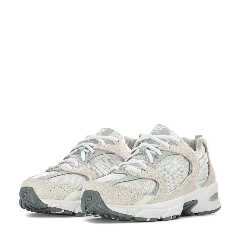 Wide women’s sneakers front view in light beige with grey accents and white laces