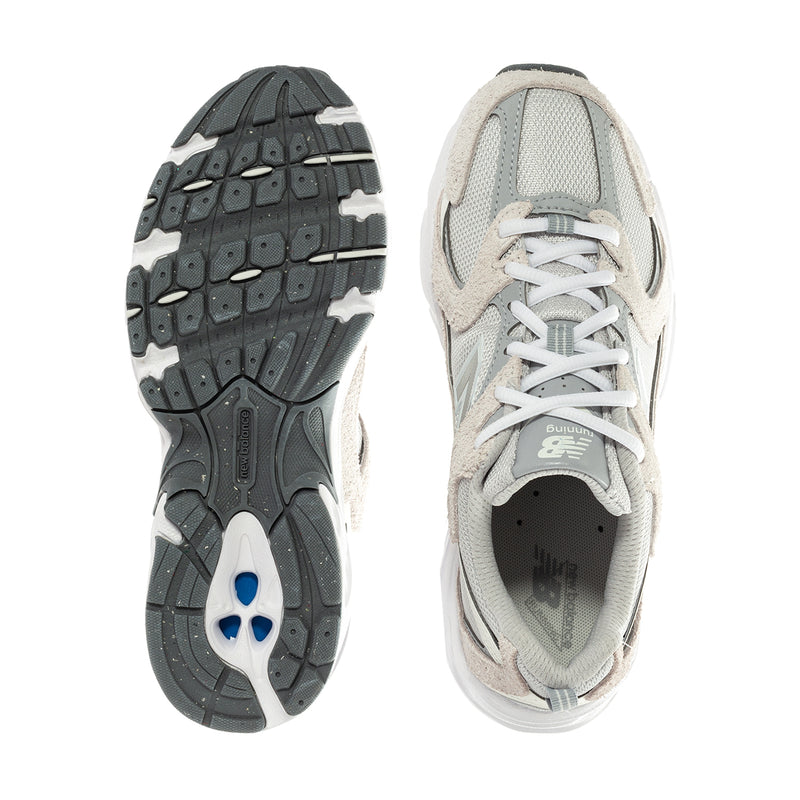 Wide women’s sneakers sole and upper view: grey outsole tread, beige upper, white laces