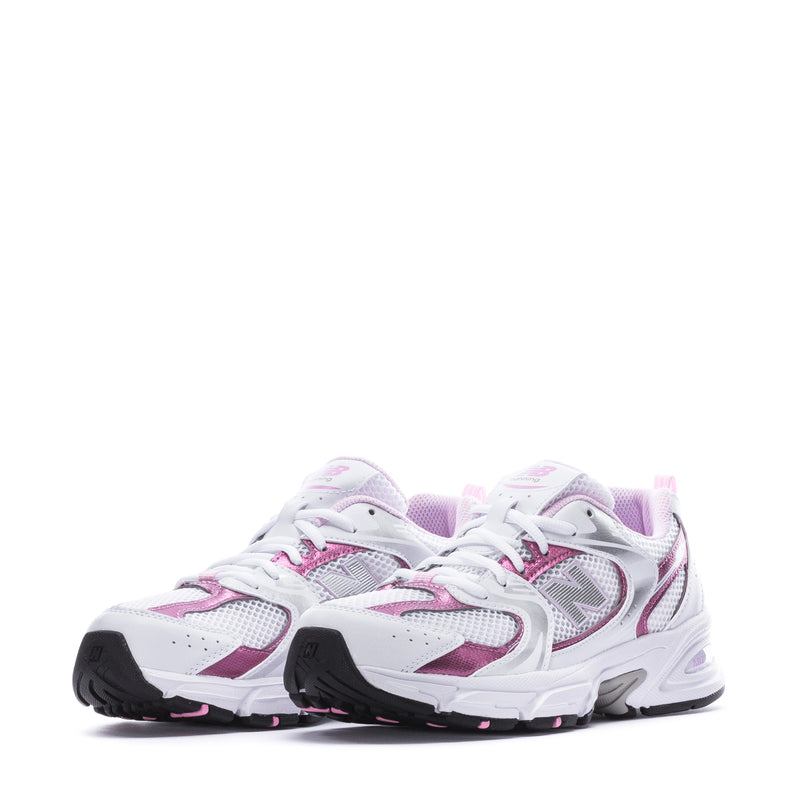 Youth lace-up running sneaker in white with pink accents, front-to-side view