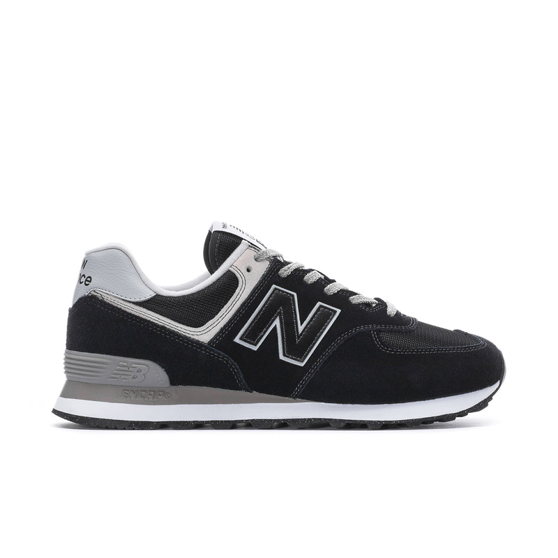 Men's New Balance 574 extra-wide sneakers in black with white accents, lace-up.