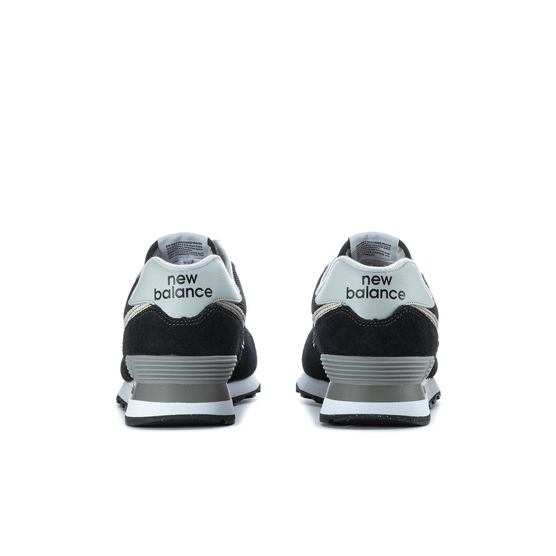 Men's New Balance 574 extra-wide sneakers, rear view with heel “new balance” branding.
