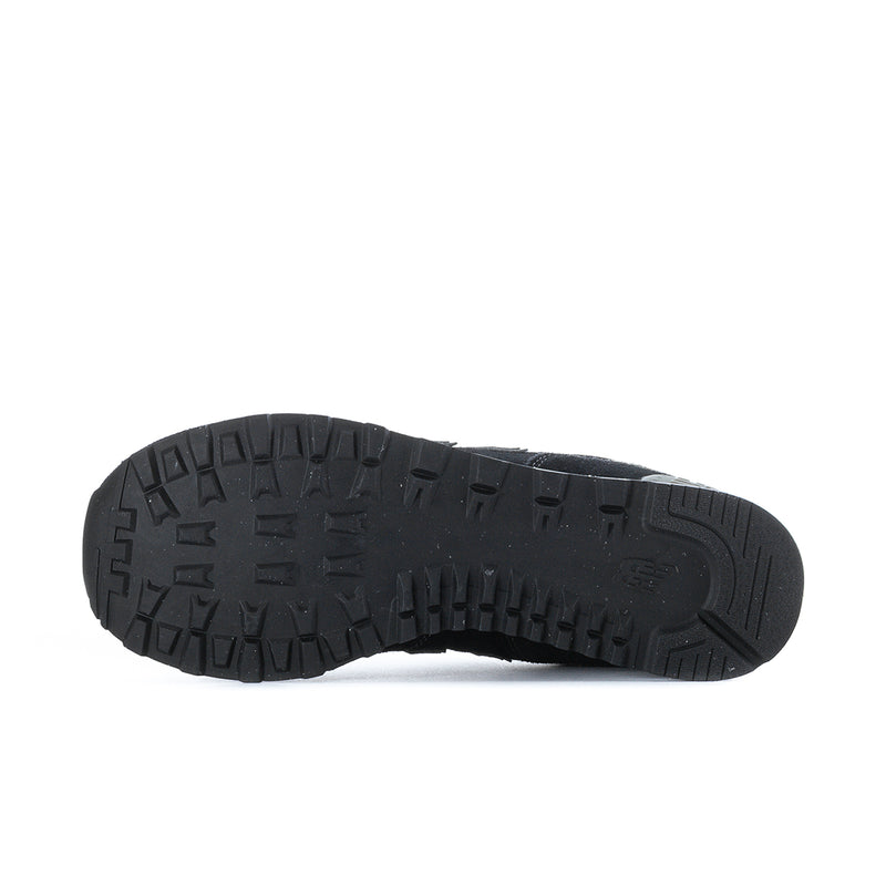 Men's New Balance 574 extra-wide sneakers outsole with deep tread, dark rubber base.