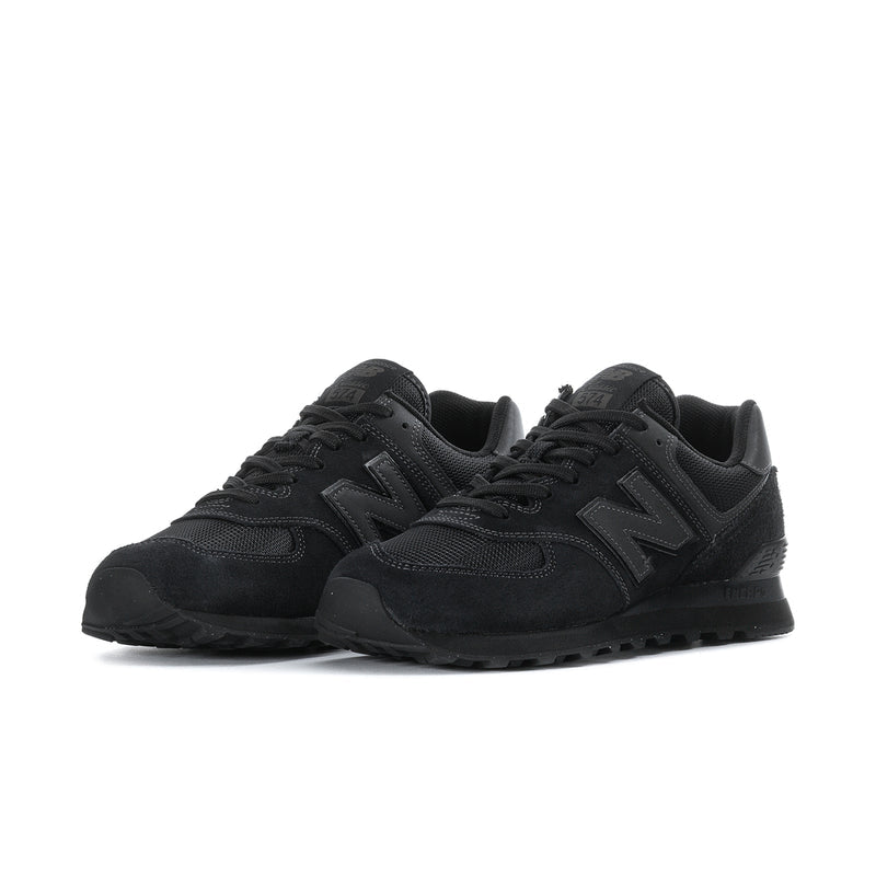 Men's New Balance 574 sneakers, black pair with layered panels and lace-up uppers.