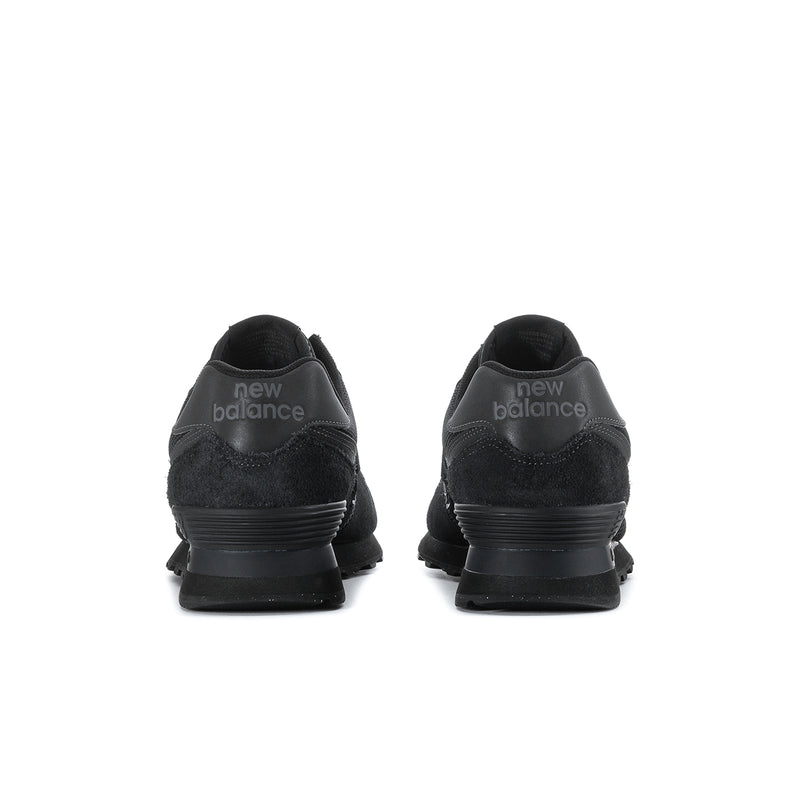 Men's New Balance 574 sneakers in black, heel view with 'new balance' branding.