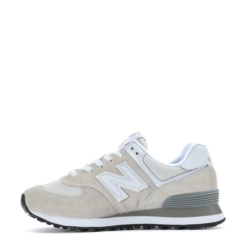 Women's New Balance 574 wide sneakers, light taupe and white, lace-up runner profile.