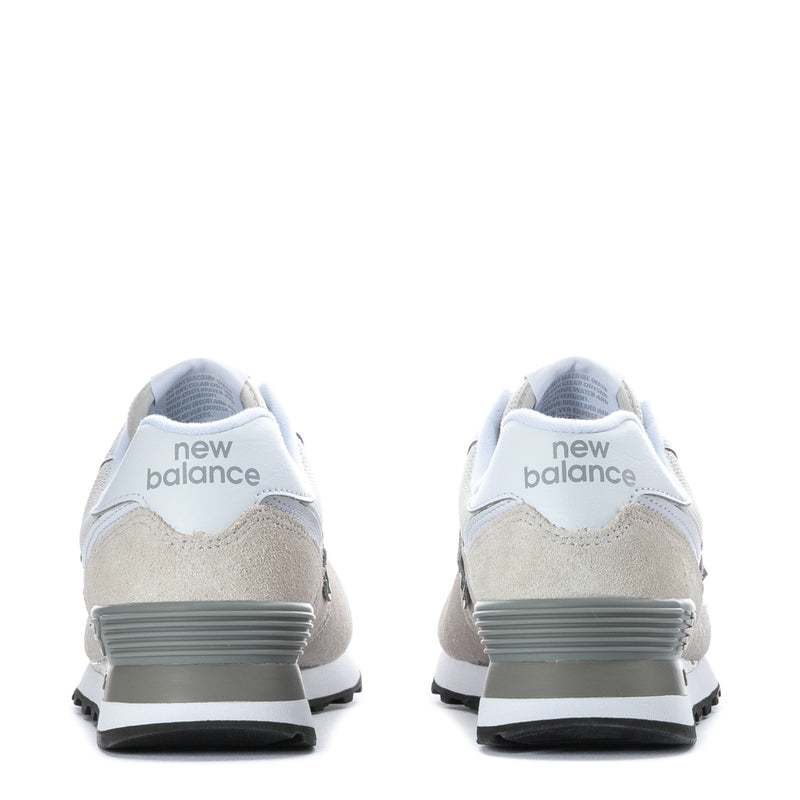 Women's New Balance 574 wide sneakers, 'new balance' heel branding, rubber heel tab.