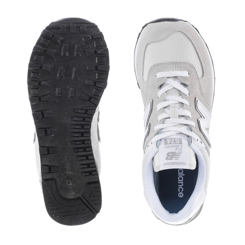 Women's New Balance 574 wide sneakers, white upper with blue sole accents, lace front.