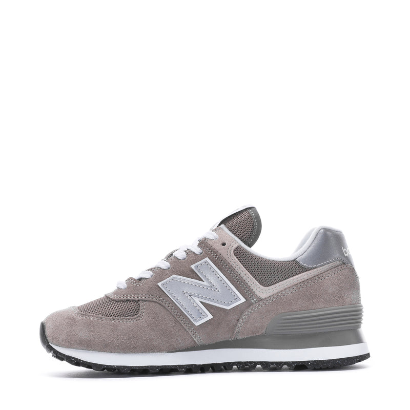 Women's New Balance 574 side view sneakers in taupe-grey suede with white laces