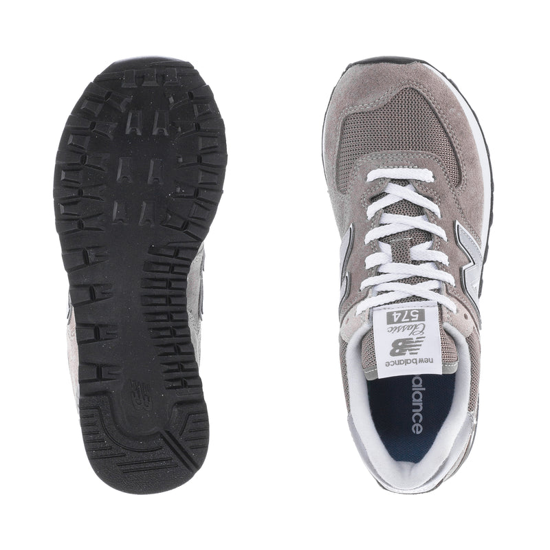 Women's New Balance 574 outsoles and inner side view, black tread sole and grey upper