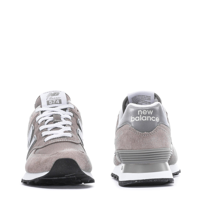 Women's New Balance 574 sneakers, front and heel view in grey suede with white laces