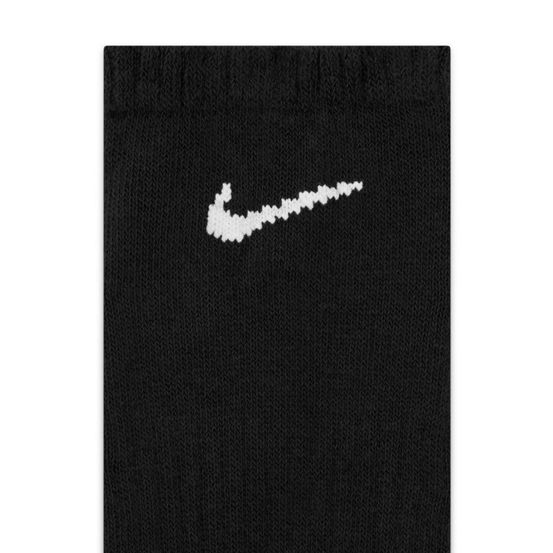 Black knit no-show sock close-up with white swoosh logo
