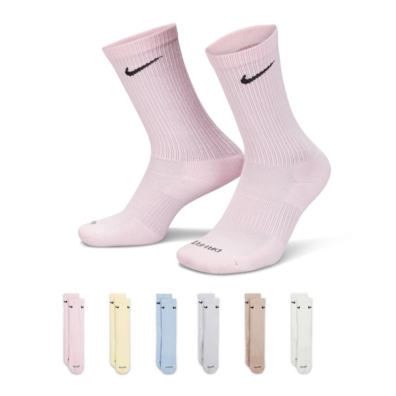 Light pink crew socks with Nike swoosh, cushioned sole and ribbed cuff (pair).
