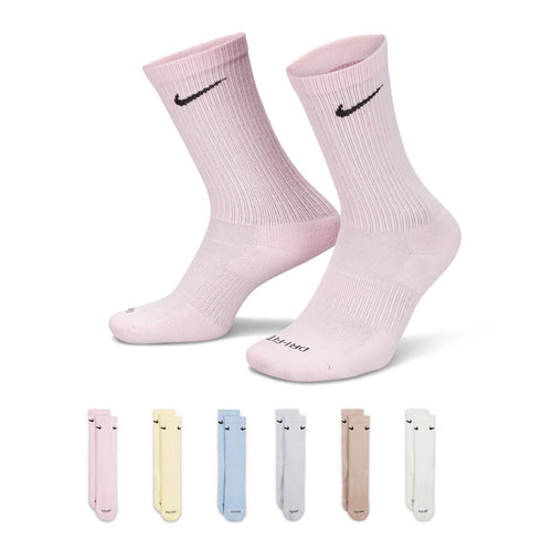 Light pink crew socks with Nike swoosh, cushioned sole and ribbed cuff (pair).