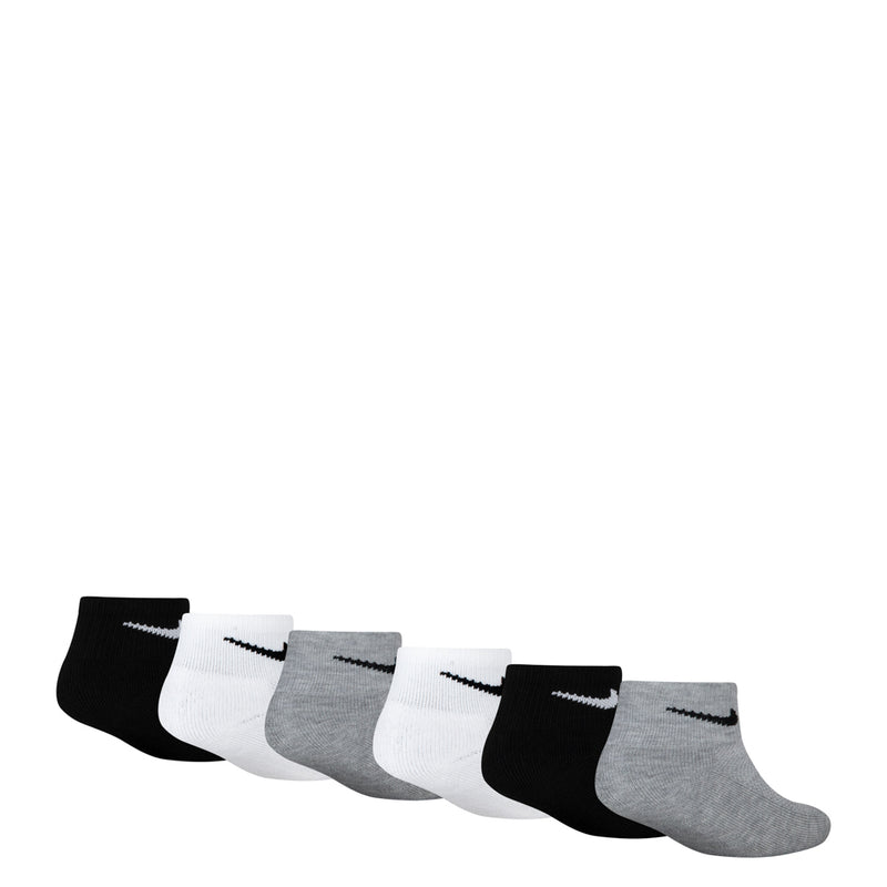 Six-pack quarter crew socks laid out in rows: black, white, and gray with Swoosh