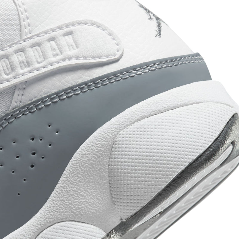 Kids' sneaker midsole and sidewall detail in white and cool grey, textured outsole edge