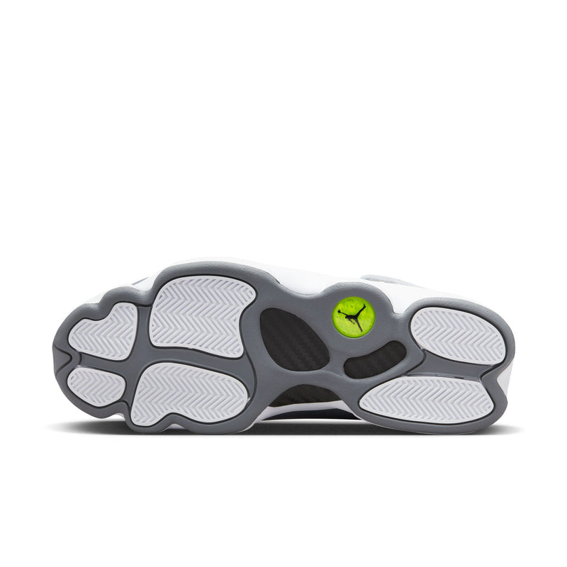 Men's sneakers outsole view with traction pattern and green Jumpman heel detail