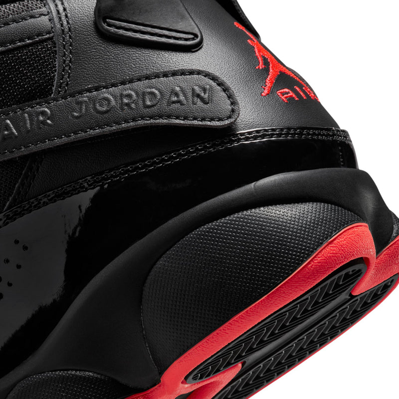 Men's black high-top sneaker with Air Jordan heel branding and red sole trim