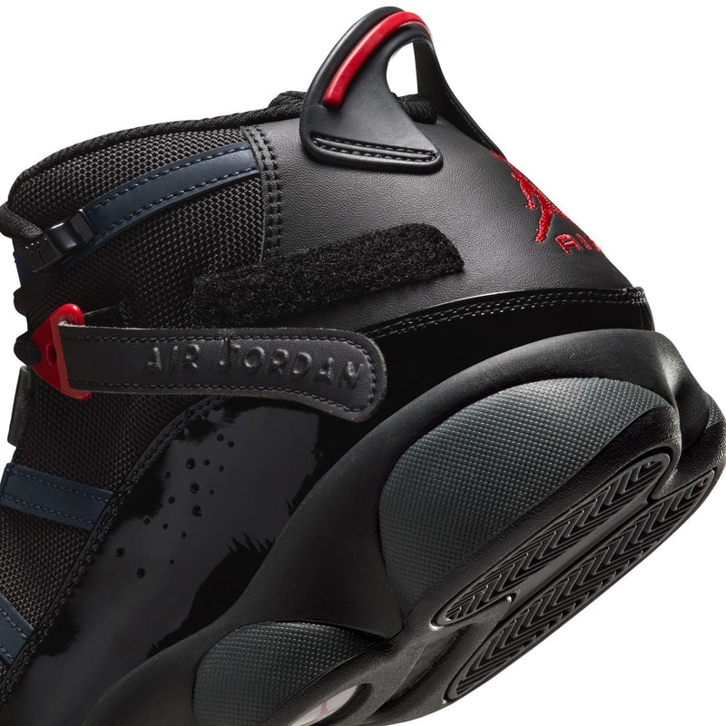 Close-up of men's high-top shoe heel and ankle strap with black, blue, and red accents