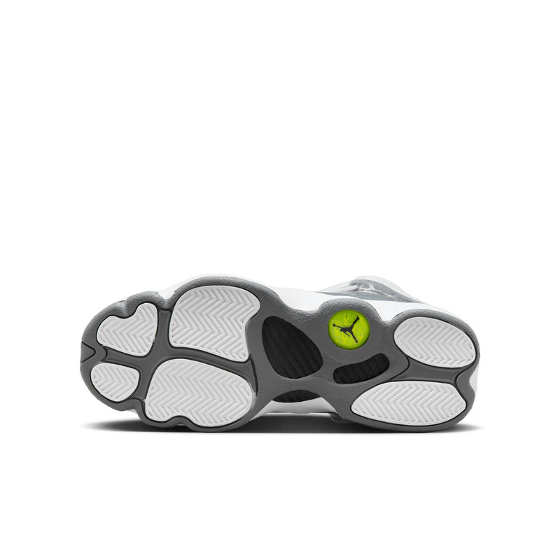 Youth sneaker outsole with tread pattern and lime green Jumpman logo.