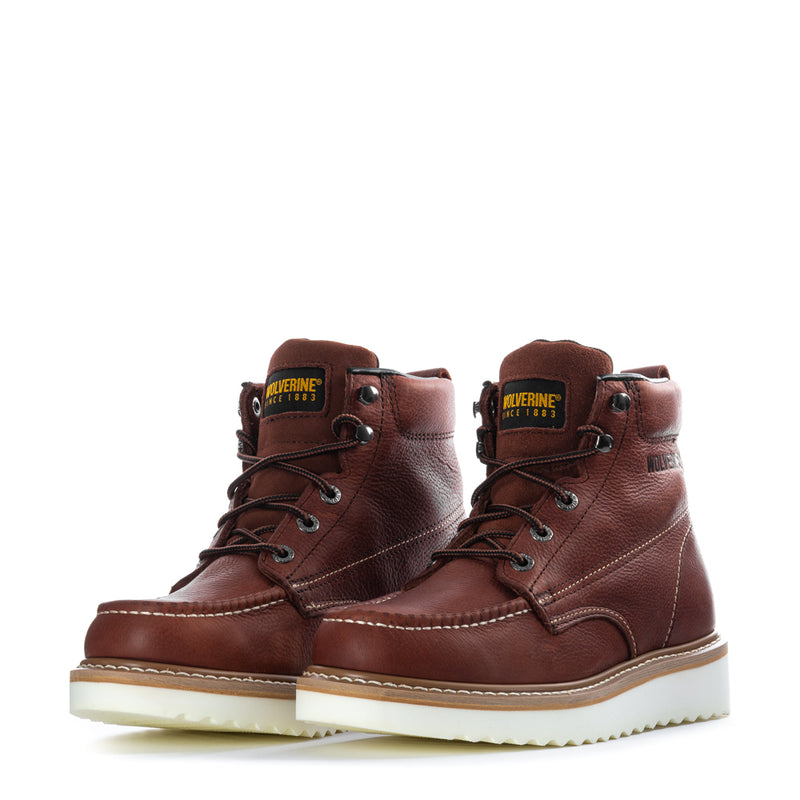 Pair of men's rust lace-up work wedge boots with cushioned tongue and side stitching