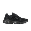 Black athletic sneaker with mesh upper, lace-up, and thick cushioned sole
