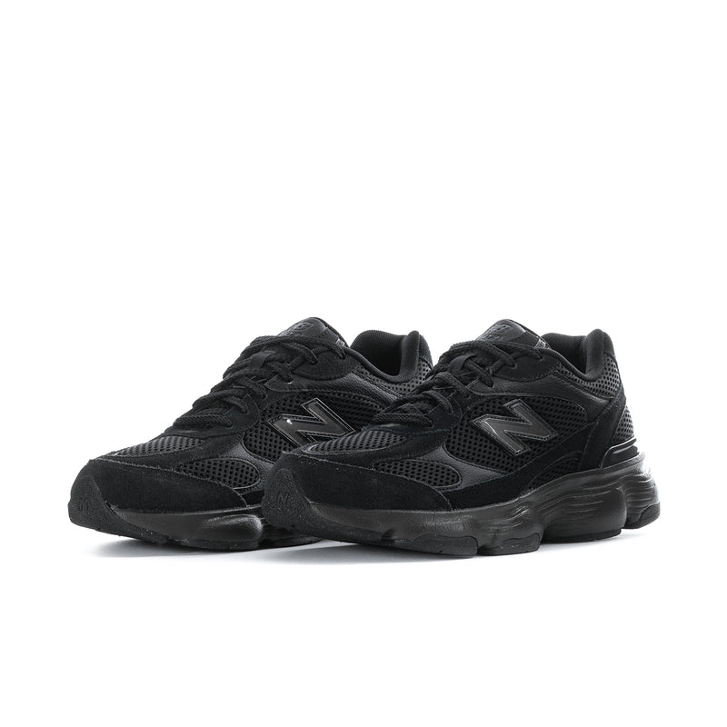 Black athletic sneakers, lace-up mesh with oversized rubber sole, side-by-side