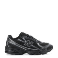 Kids running shoes in black with silver N logo and cushioned sole