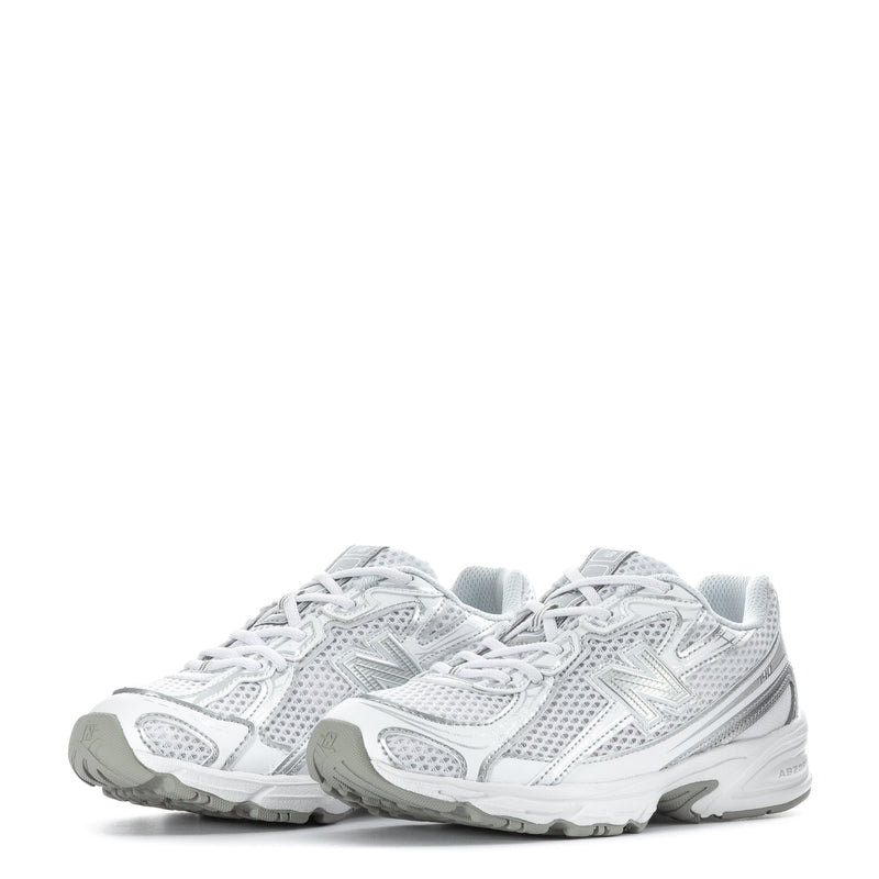 Kids running sneakers pair, white mesh upper with silver metallic N logos