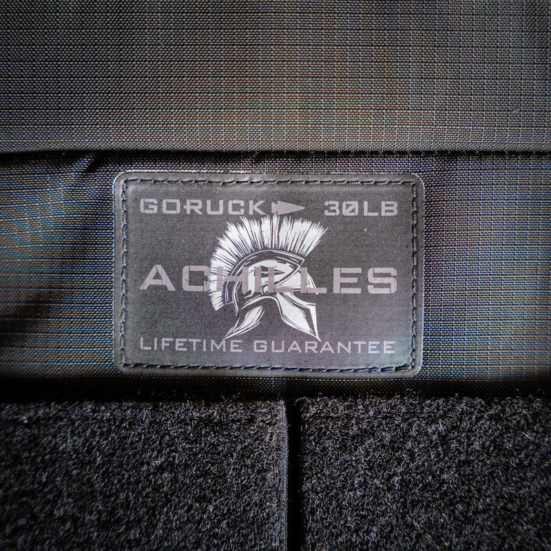 Close-up of the "GORUCK 30LB ACHILLES LIFETIME GUARANTEE" patch with a Spartan helmet on the Achilles | Men's Weighted Vest.