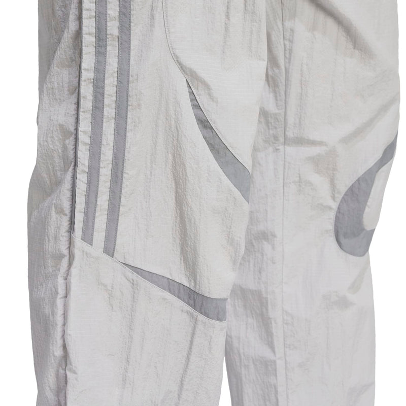 Men's woven track pants fabric detail, grey side stripe and contrast panel
