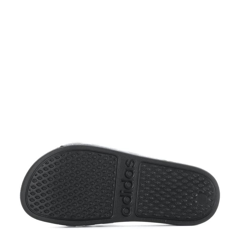 Kids black slide sandal outsole with textured grip pattern
