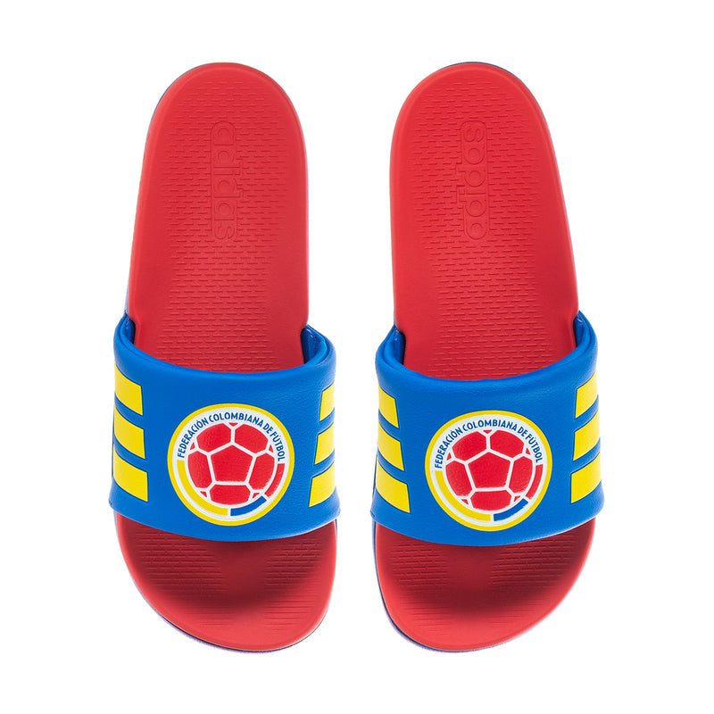 Men's Adilette Comfort 2.0 sandals showing red outsole and blue heel straps with crest