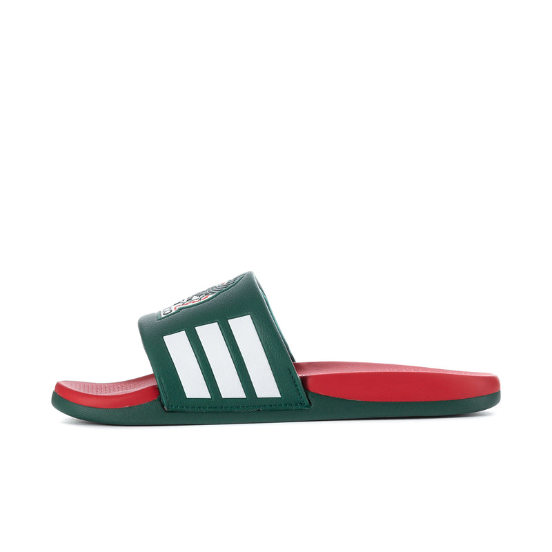 Men's green slide sandals with white triple stripes over a red footbed