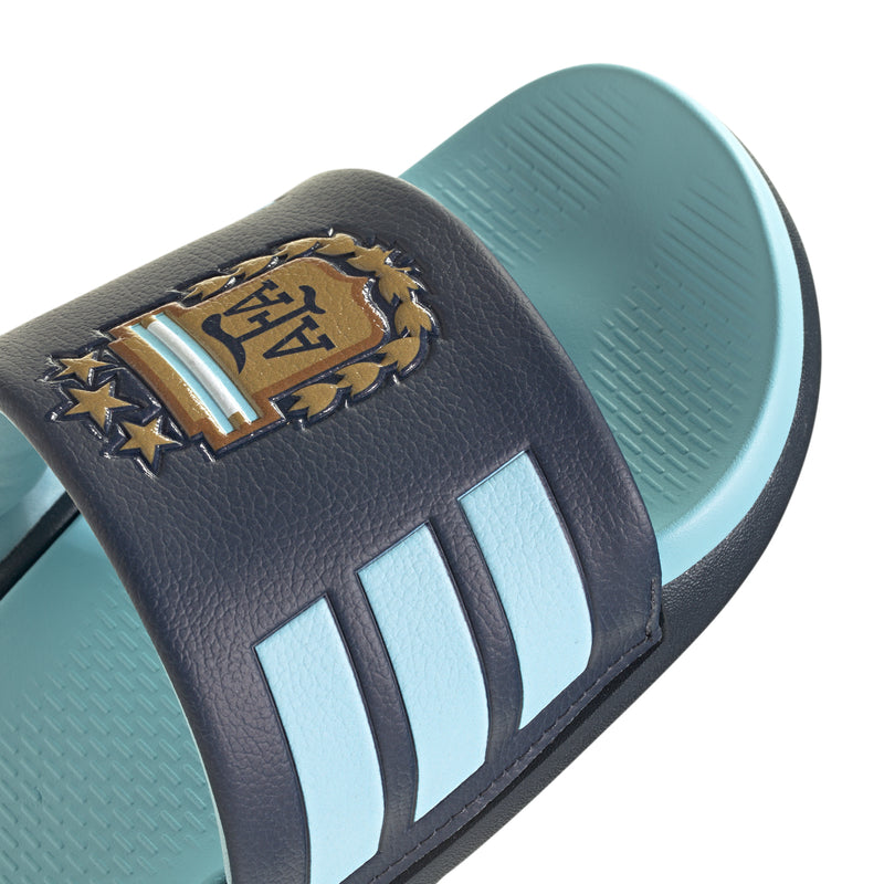Men's slide sandals close-up of navy strap with AFA crest and three white stripes